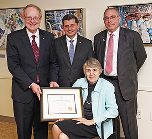 Dr. Virginia Latham, with MMS Officers (left to right) Dr. James Gessner, Dr. Alain Chaoui, and Dr. Henry Dorkin.