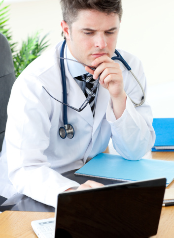 Male doctor with laptop