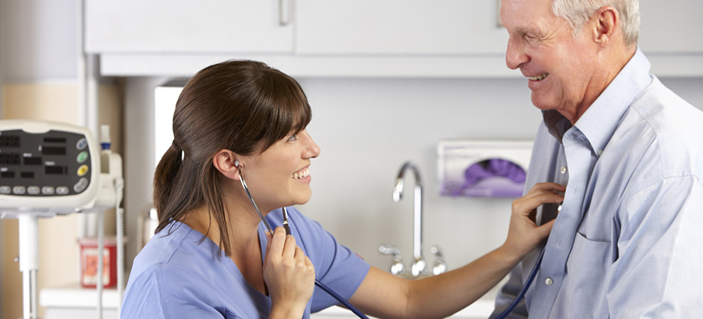Doctor Listening To Male Patient's Chest