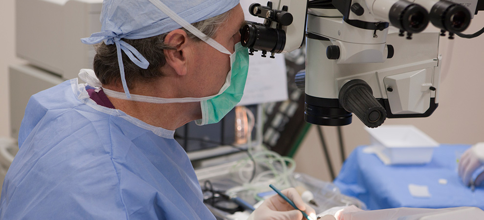 Ophthalmologist making incision during cataract surgery